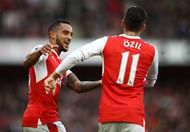 LONDON, ENGLAND - OCTOBER 15: Theo Walcott of Arsenal celebrates with Mesut Ozil after he scored his team's first goal during the Premier League match between Arsenal and Swansea City at Emirates Stadium on October 15, 2016 in London, England.  (Photo by Julian Finney/Getty Images)